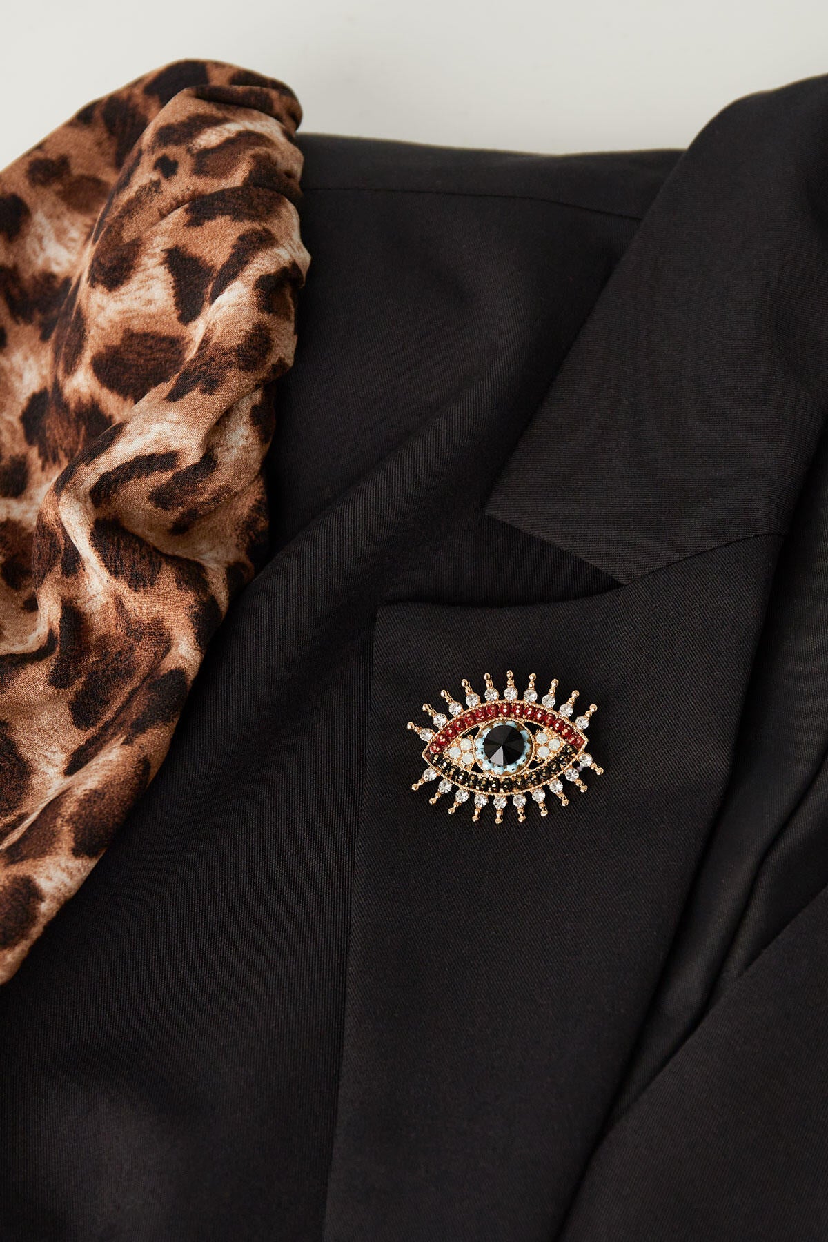 charming eye broche