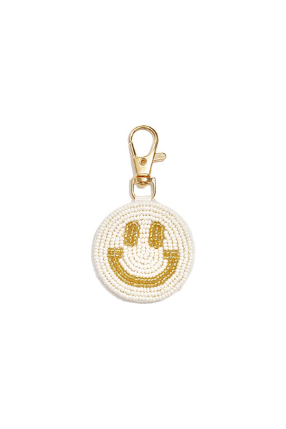 Tasbedeltjes met een lachend gezichtje, casual glazen accessoires voor dagelijks gebruik.