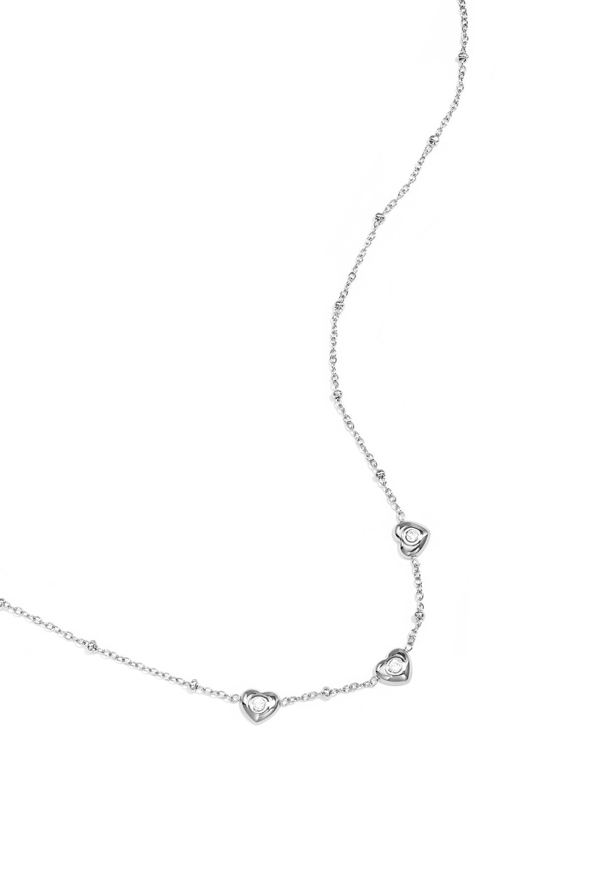 Ketting met bolletjes en hartjes met steen