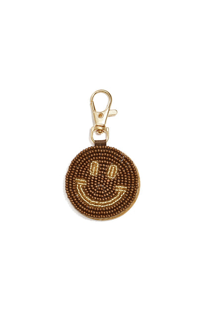 Tasbedeltjes met een lachend gezichtje, casual glazen accessoires voor dagelijks gebruik.