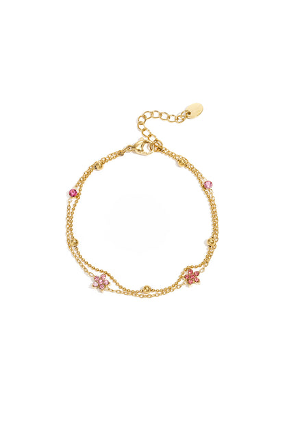 Armband met gekleurde steentjes belegde bloemetjes