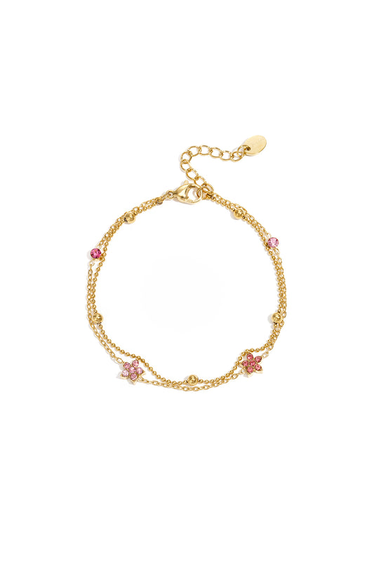 Armband met gekleurde steentjes belegde bloemetjes
