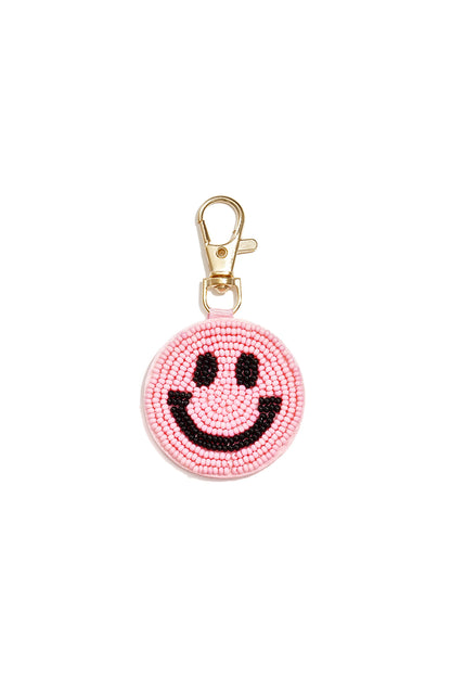 Tasbedeltjes met een lachend gezichtje, casual glazen accessoires voor dagelijks gebruik.